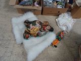 a pile of assorted items on the floor next to a chair