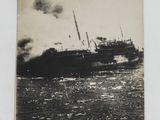 a black and white photo of a ship in the water