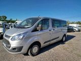 the silver van is parked in a lot with other vehicles