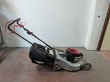 an image of a lawn mower in a garage