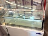 an image of a refrigerated display case in a store