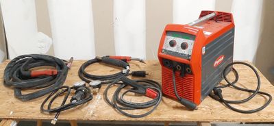 an image of a table with a bunch of wires and a welding machine