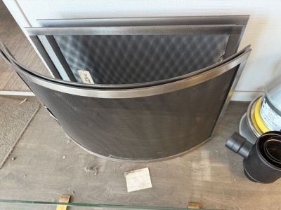 an image of a stove with a glass top and a metal door