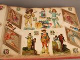 an open book with pictures of people on it