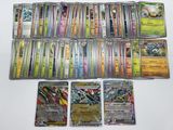 a lot of pokemon cards that are on the table