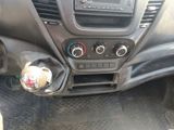 a car dashboard with the controls on and a steering wheel