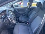 the interior of a car with the front seats folded down