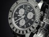 a close up of a watch on a black surface with a black background