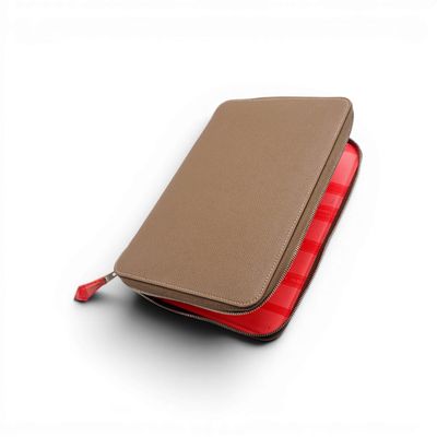 wallet on a white background with a red zipper