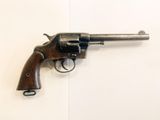 a close up of a revolver on a wall with a white background