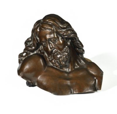 a bronze bust of jesus with long hair and a beard