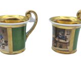 two cups that are sitting next to each other on a table
