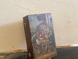 a picture of a painting on the floor next to a wall
