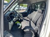 two seats in the back of a van that is parked in a parking lot