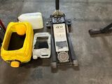 a fork lift with a yellow bucket on it and a yellow container next to it