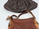 brown and brown purses sitting on a white table next to a laptop