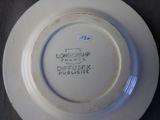 a white plate with writing on it on a table