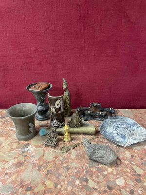 a table with various items on it and a red wall