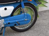 a blue motorcycle parked on the side of the street