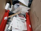 a cardboard box full of assorted items in it