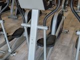 several stationary exercise bikes in a gym room
