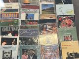 a lot of cd ' s and cds on the table