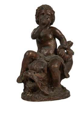 statue en bronze représentant un garçon assis sur un rocher avec un chien