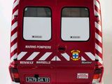 a red and white firetruck that is on a white surface