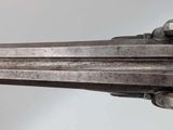 a close up of a gun that is on display in a museum