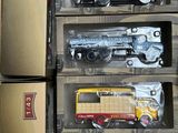 many different types of toy trains and trucks in boxes