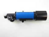 a close up of a blue and black telescope on a white surface