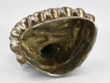 an image of a silver ring with a shell inside of it