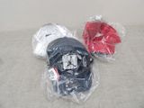 two hats that are wrapped in plastic bags on the floor