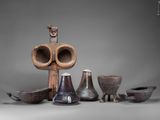 many different types of vases and bowls on the table