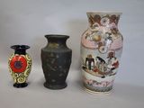 three vases sitting next to each other on a table