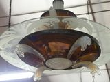 a glass chandelier hanging from a ceiling in a room