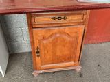 a small table with a drawer on top of it