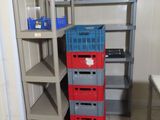 a stack of crates sitting on a shelf in a room