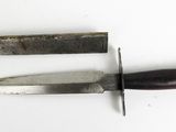 two knives that are laying side by side on a white surface