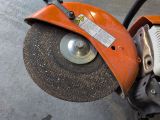 an orange machine that is sitting on the ground