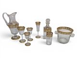 an assortment of glassware including a pitcher, cups, and glasses