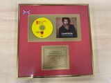 a picture of a picture of a man with a cd in a gold frame