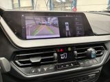 the interior of a car with a gps device on the dashboard