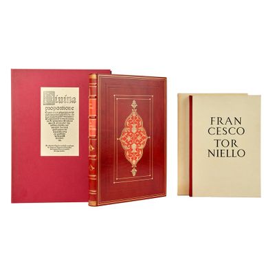 two books are sitting next to each other on a white surface