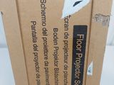 a cardboard box with a sticker on it sitting on a table