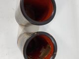 two empty wine bottles sitting on a white surface