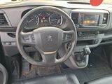 dashboard of a car with a steering wheel and dashboard gauges