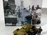 a small toy soldier standing next to a toy tank