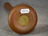 a close up of a wooden baseball bat with a tag on it