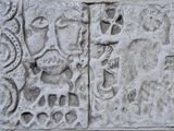 a close up of a carving on a stone wall